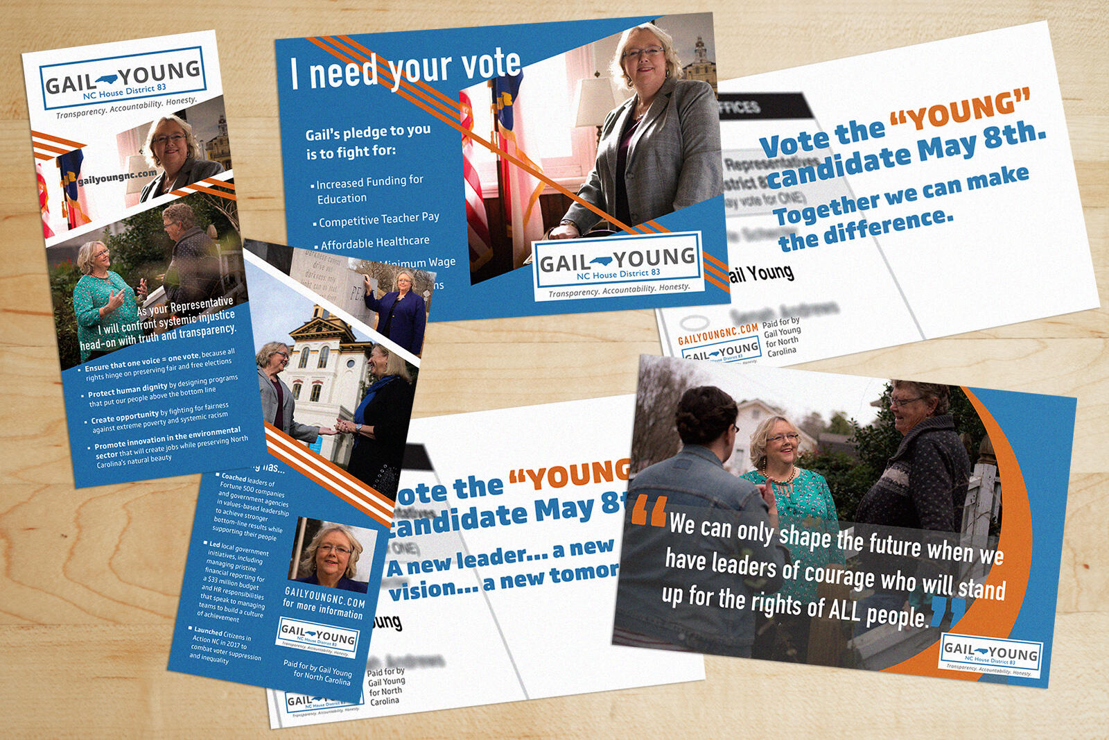 brochures and postcards to vote for Gail Young with blue and orange lines and backgrounds