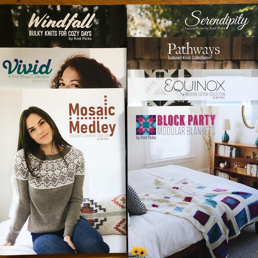 seven books stacked in two columns: Windfall, Vivid, Mosaic Medley, Serendipity, Pathways, Equinox, Block Party