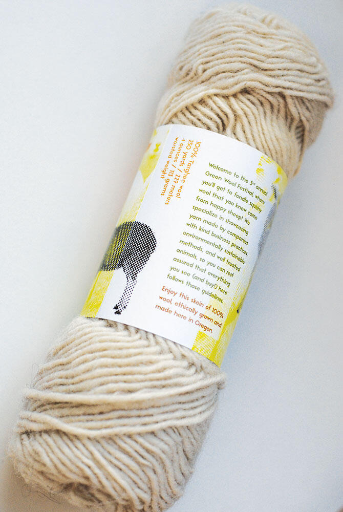 skein of natural colored yarn with back of label showing, fine type and back side of a sheep