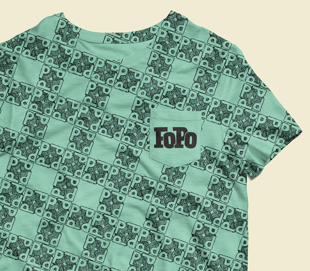 teal t-shirt with P repeating pattern and FoPo logo on pocket