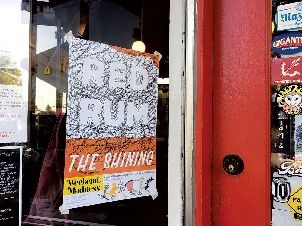 The Shining Poster taped onto the window of a bar